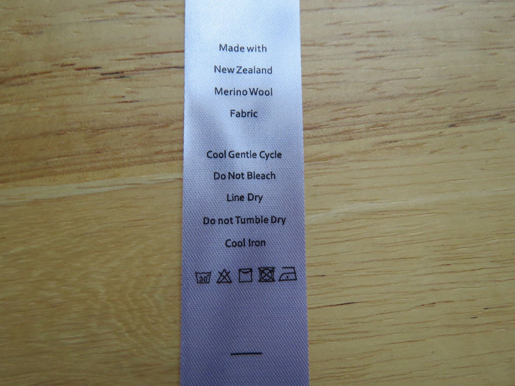 20 White Satin washing instructions/ Made with New Zealand Merino wool labels