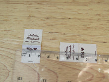 Load image into Gallery viewer, 25 Hand made between tiara  and  fancy scroll cotton flag labels. 2 x 2cm