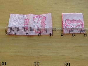 50 Pink Handmade 2 wings and with heart symbol for love on back satin flag label
