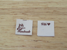 Load image into Gallery viewer, 25 Butterfly Hand made  with heart (love) cotton flag labels. 2 x 2cm