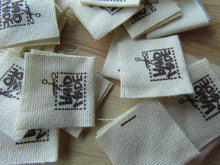 Load image into Gallery viewer, 6 Handmade in Box with Scissors Flag Cotton Labels 2 x 2cm folded - 50