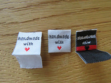 Load image into Gallery viewer, 10 White Handmade with red heart 2 x 2cm satin labels.