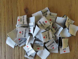25 White Handmade with red heart 2 x 2cm satin flag shape labels