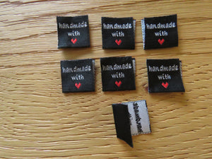 50 Black Handmade with red heart 2 x 2cm satin flag labels.