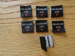25 Black Handmade with red heart 2 x 2cm satin flag labels.