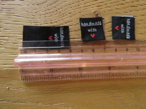 50 Black Handmade with red heart 2 x 2cm satin flag labels.