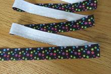 Load image into Gallery viewer, 50 yard/ 45.6m roll  Coloured Stars Wider 25mm Black FOE FoldOver Elastic