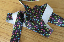 Load image into Gallery viewer, 50 yard/ 45.6m roll  Coloured Stars Wider 25mm Black FOE FoldOver Elastic