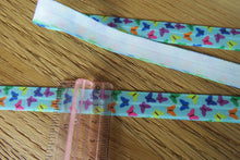 Load image into Gallery viewer, 4m Mini Multicoloured Butterflies on Blue FOE 15mm FoldOver Elastic